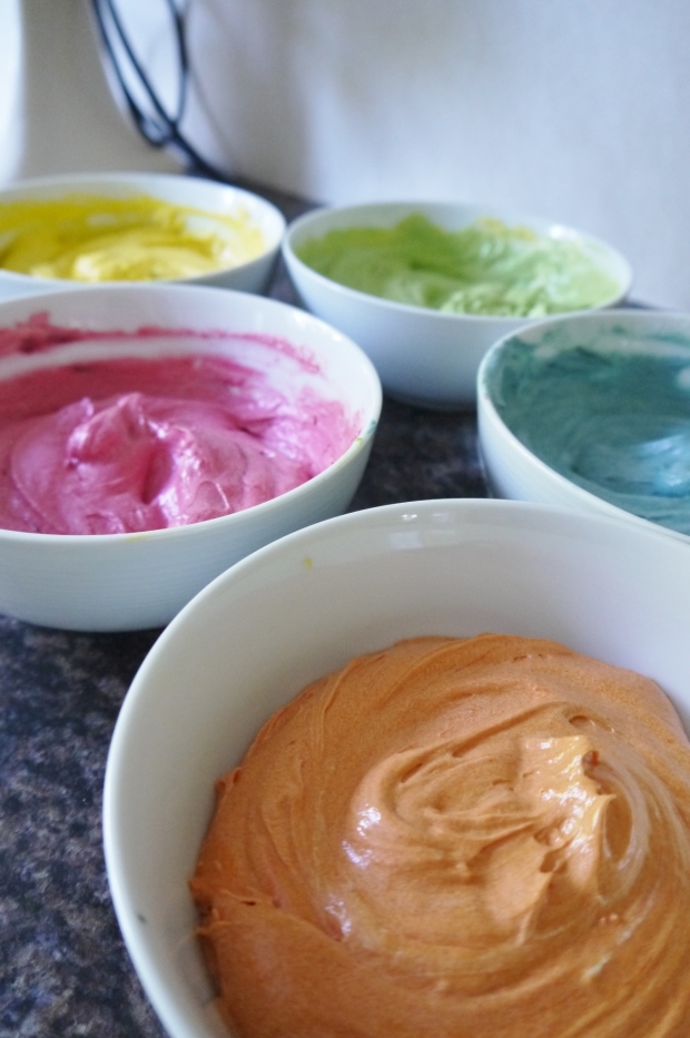 Split the sponge mixture equally between 5 bowls and colour to your preferred strength